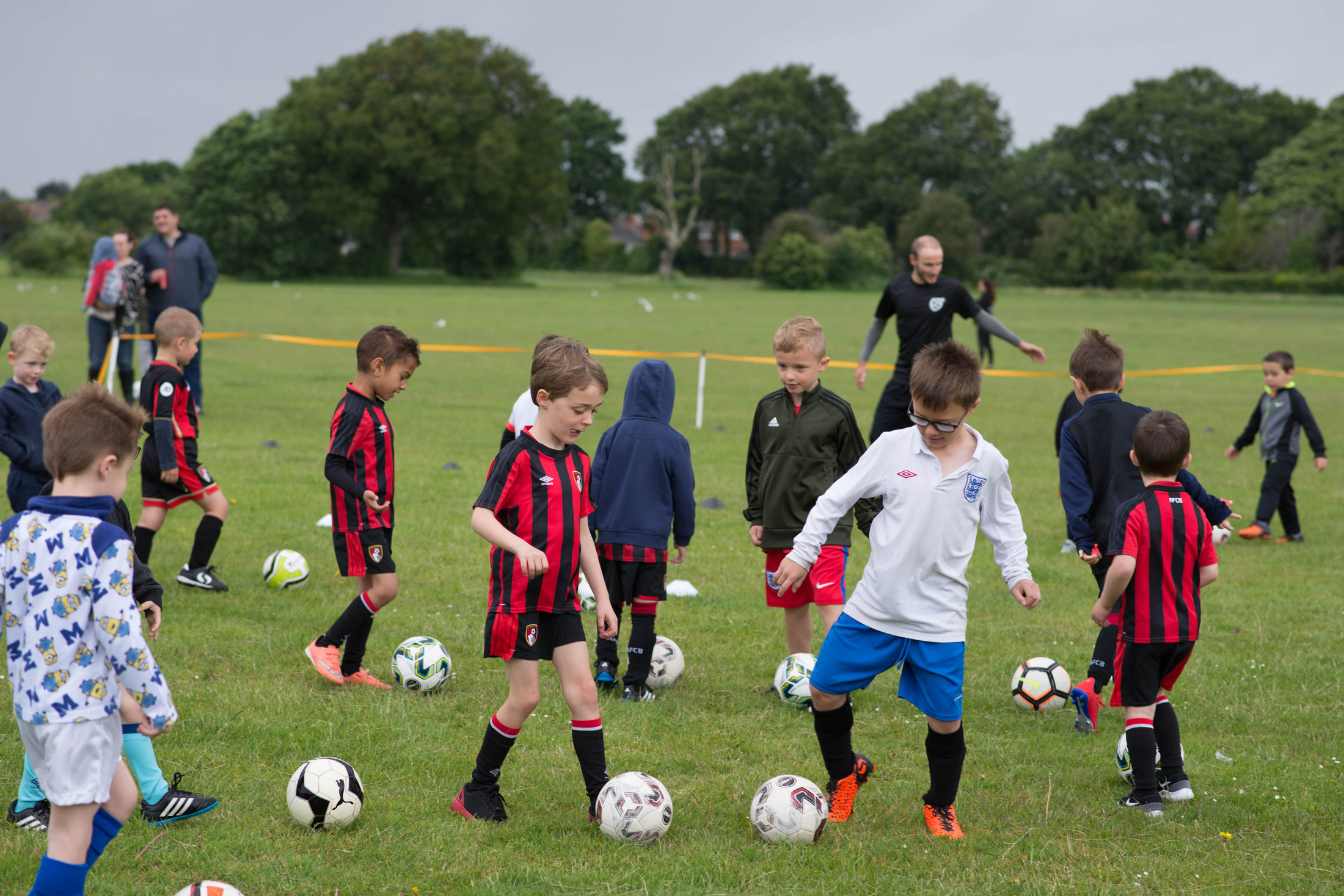 Children playing football at Slades Farm Park