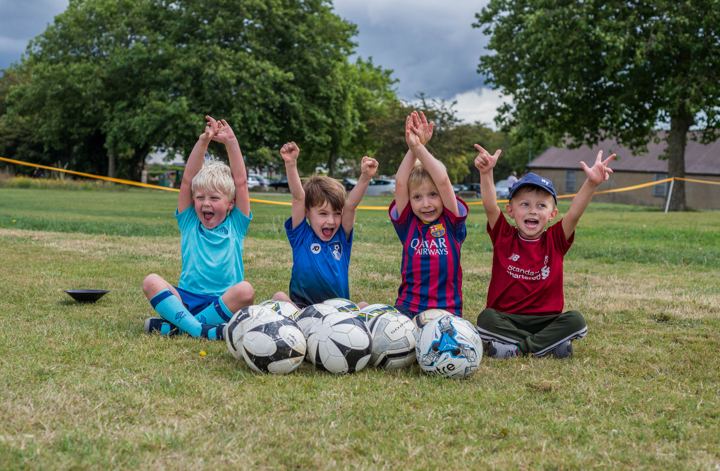 Children cheering at a Soccer Stars session